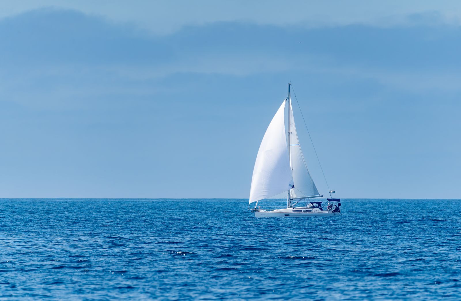 A serene sailing adventure on the blue waters of the Pacific Ocean near San Diego, California.